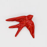 hirondelle en céramique stylisée et modernisée rouge brillant, dans sa boîte cadeau Luisa Paixão.  Coffret hirondelle stylisée - Rouge