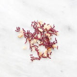 Tube of dehydrated beets and toasted almonds