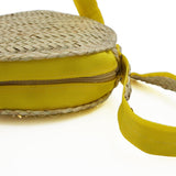 Round shoulder bag in woven straw