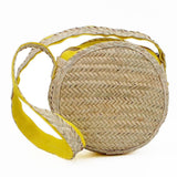 Round shoulder bag in woven straw