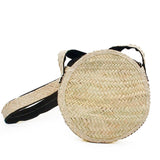 Round shoulder bag in woven straw