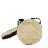 Round shoulder bag in woven straw